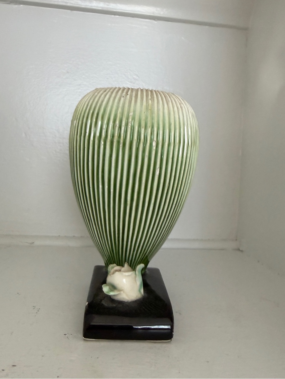 Green Ribbed Ceramic Vase on Black Base